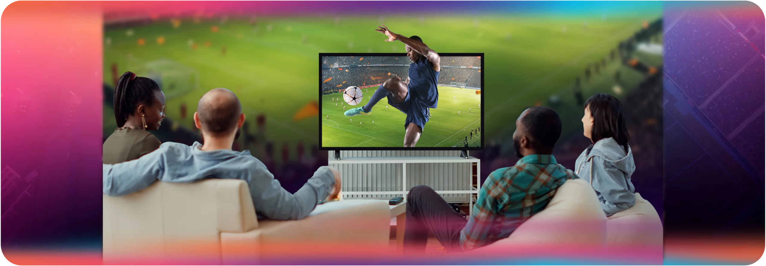 Low Latency Live Streaming for Sports- Tiers, Benchmarks & Use Cases _ Dolby OptiView _Dolby OptiView_in-body-image_1840x640 copy Four friends sitting on a couch watching a live soccer match on a large-screen TV, with a vibrant gradient background blending pink, green, and purple.
