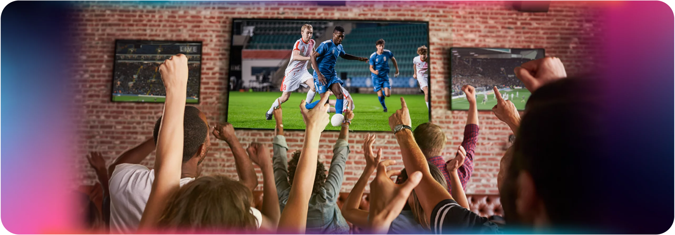 Fans cheering at watch party while watching a live soccer match on a large screen